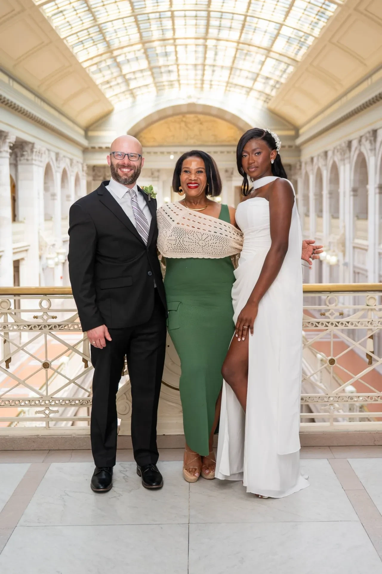Elegant ceremony in a grand hall with glass ceiling