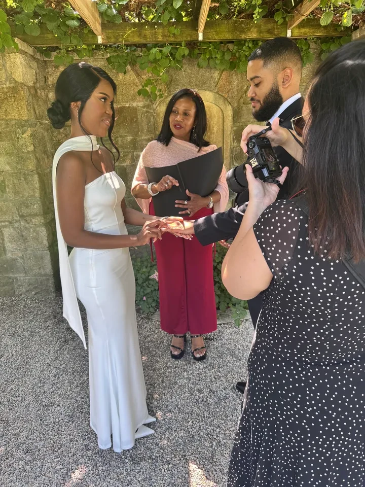 Ring exchange during intimate garden ceremony